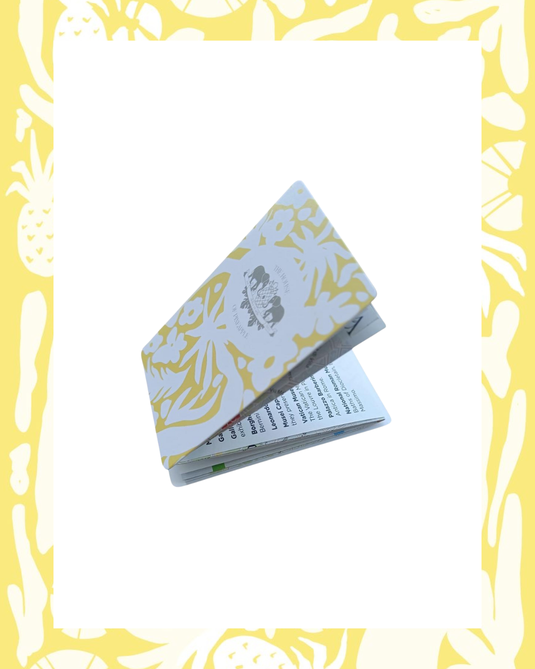 Partially open bespoke map with a floral yellow-and-white cover, featuring The House of Pineapple branding.
